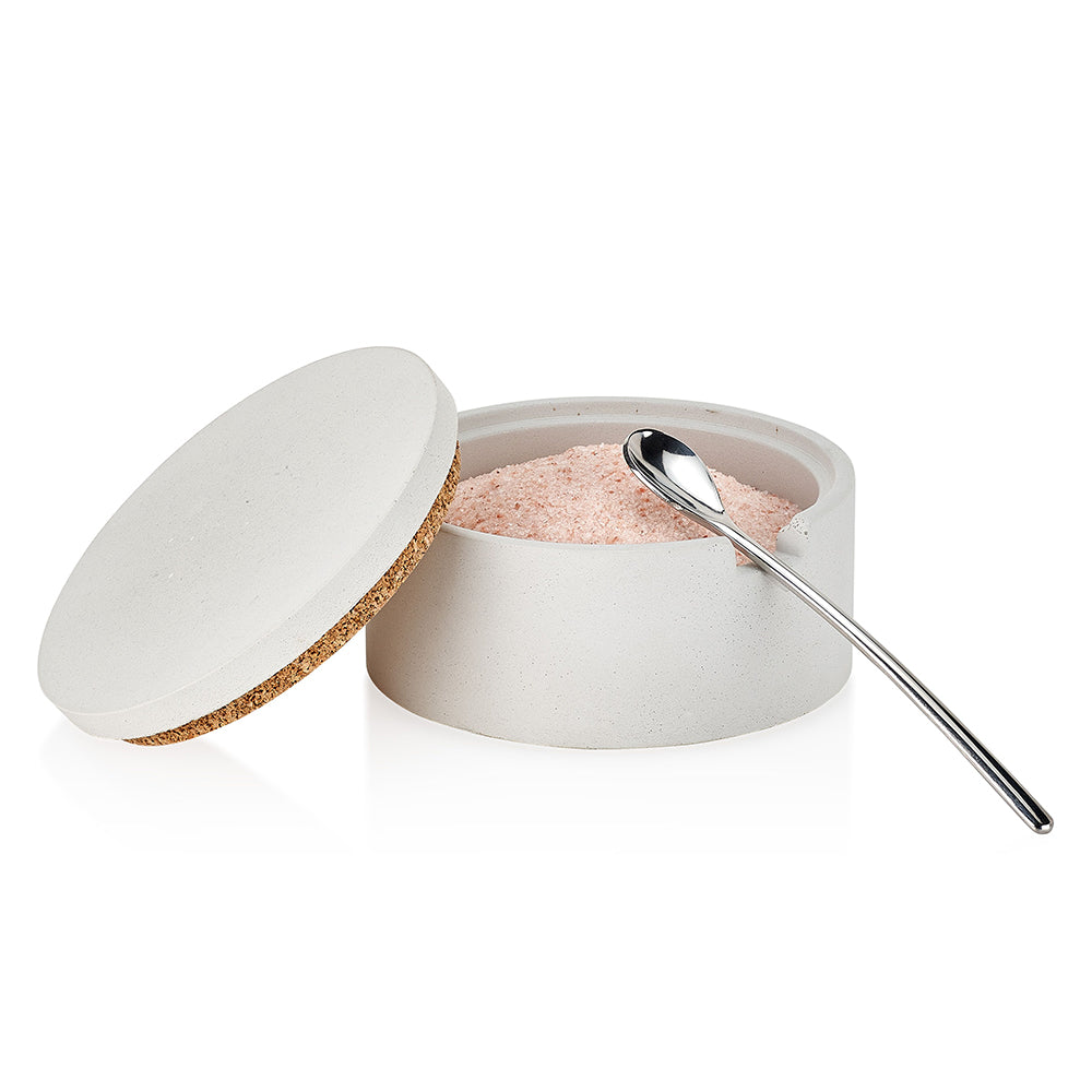 White concrete container with pink salt and a silver spoon on a white background. Henderson Garden Supply