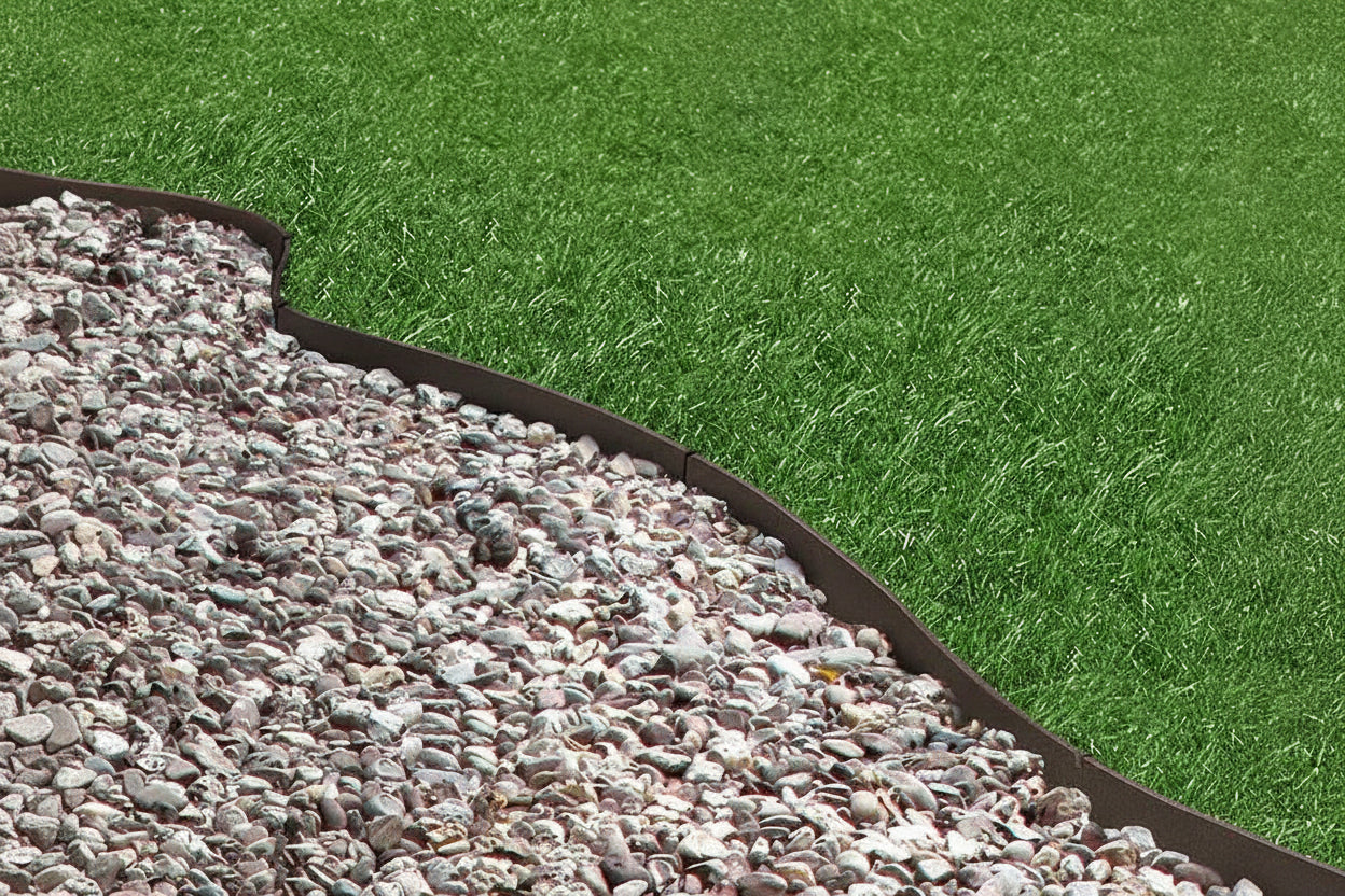 Core Edge Flexible Steel Lawn Edging show in Brown edging dividing grass from gravel path - Henderson Garden Supply
