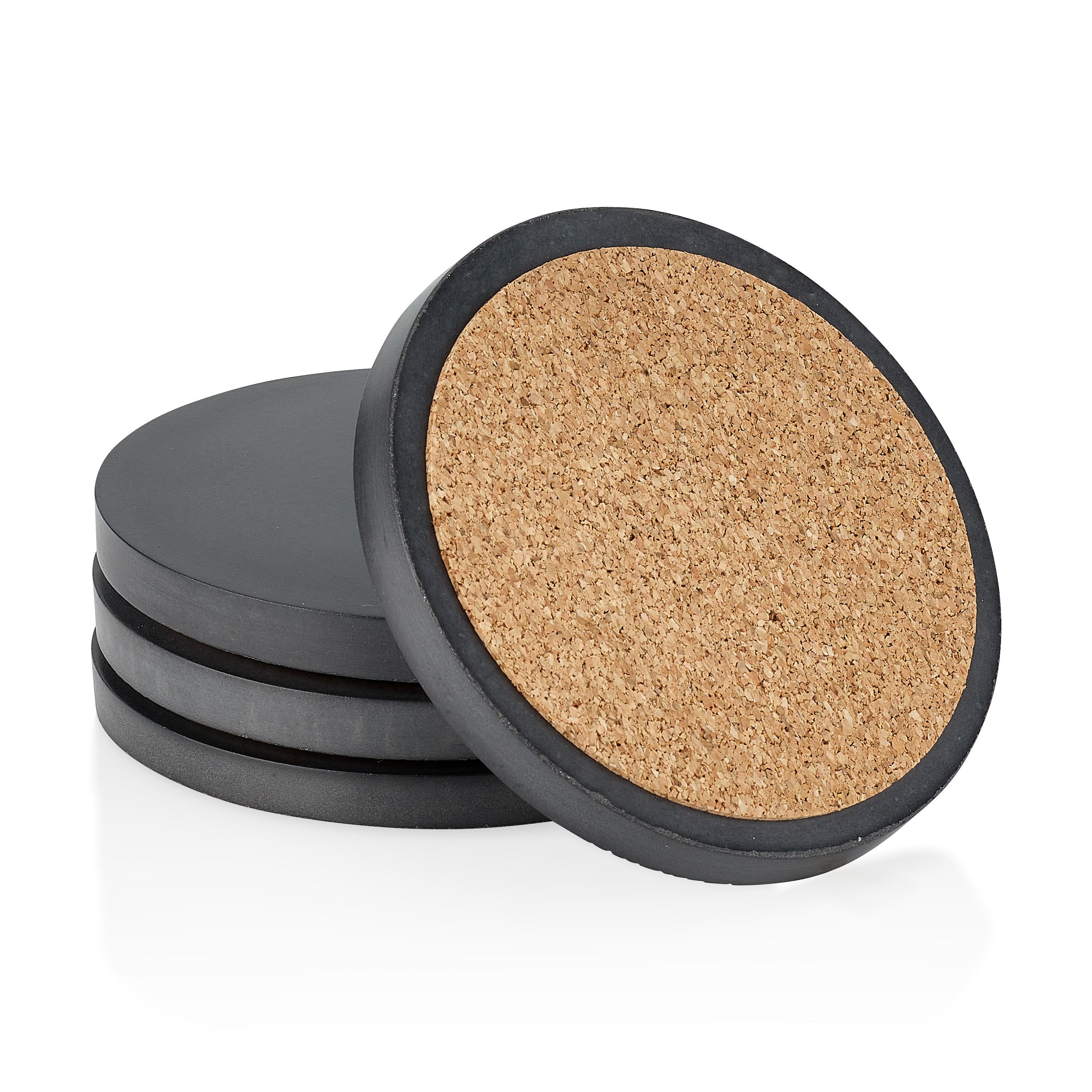 Set of four round cork coasters with black edges on a white background.  Henderson Garden Supply