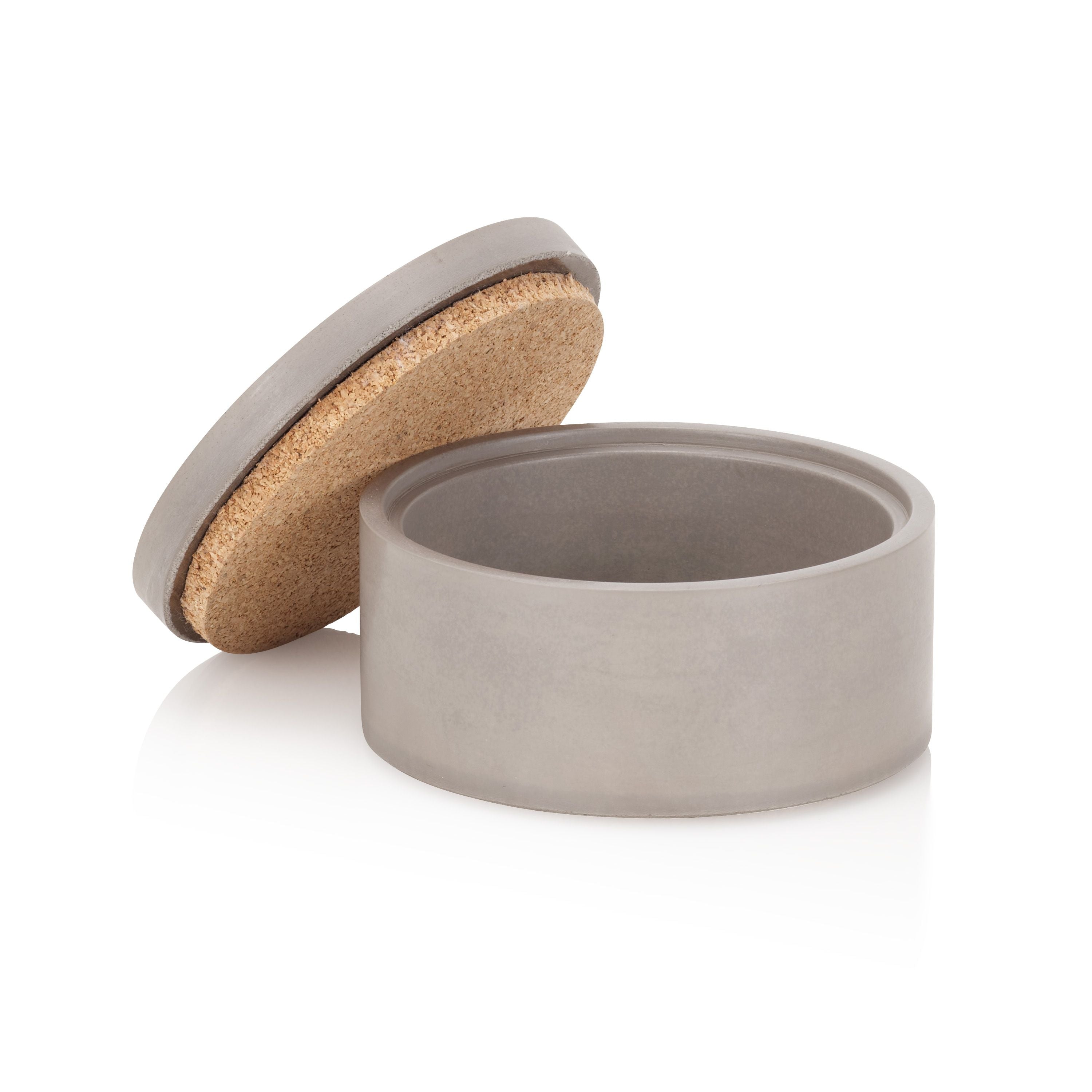 Round concrete container with cork lid on a white background.  Henderson Garden Supply