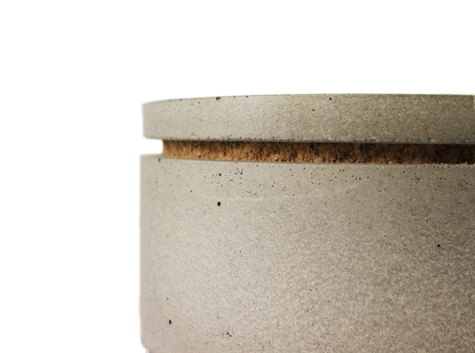 Close-up of a textured ceramic container with a wooden lid on a whitebackground.  Henderson Garden Supply