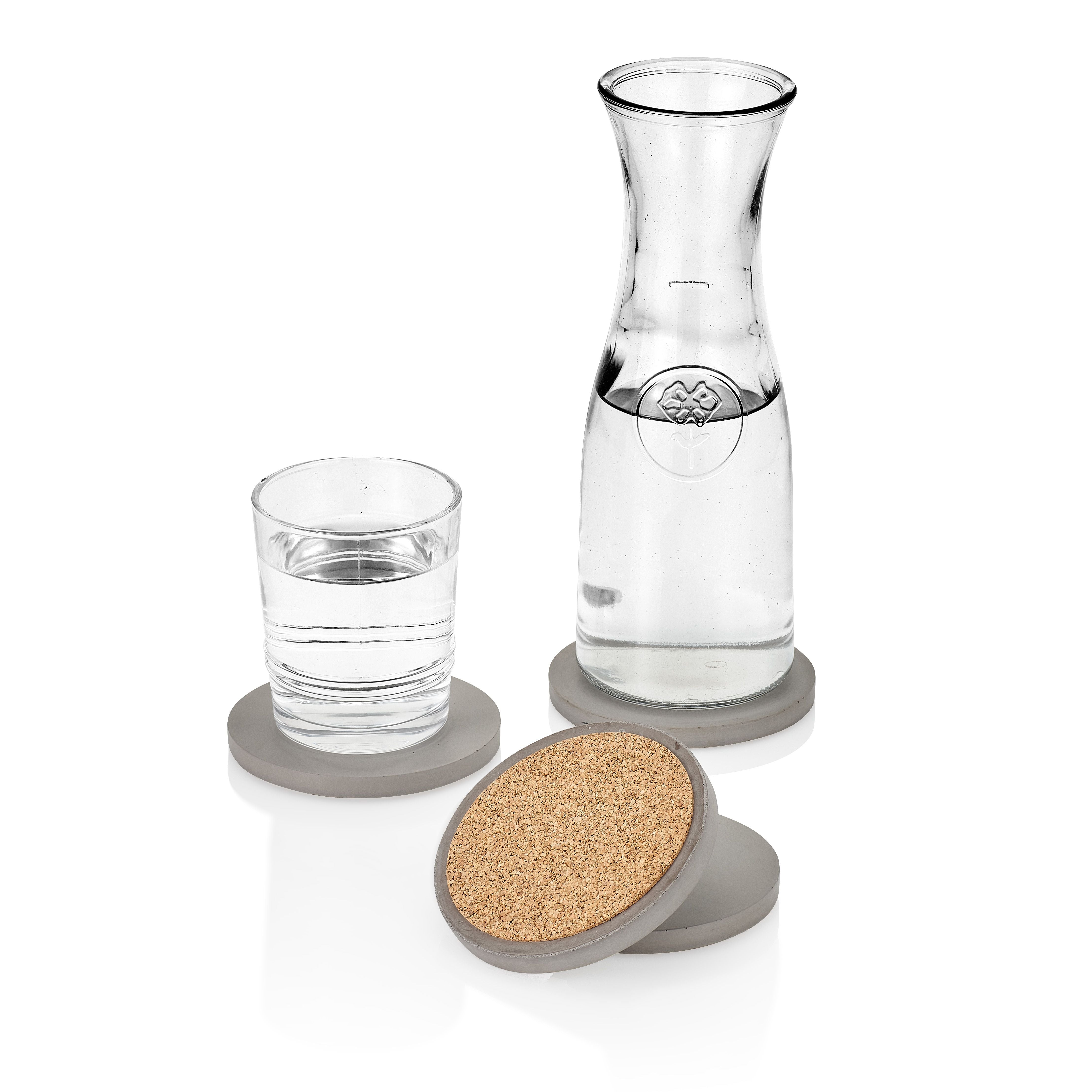 Clear glass carafe and glass with cork coasters on a white background.  Henderson Garden Supply