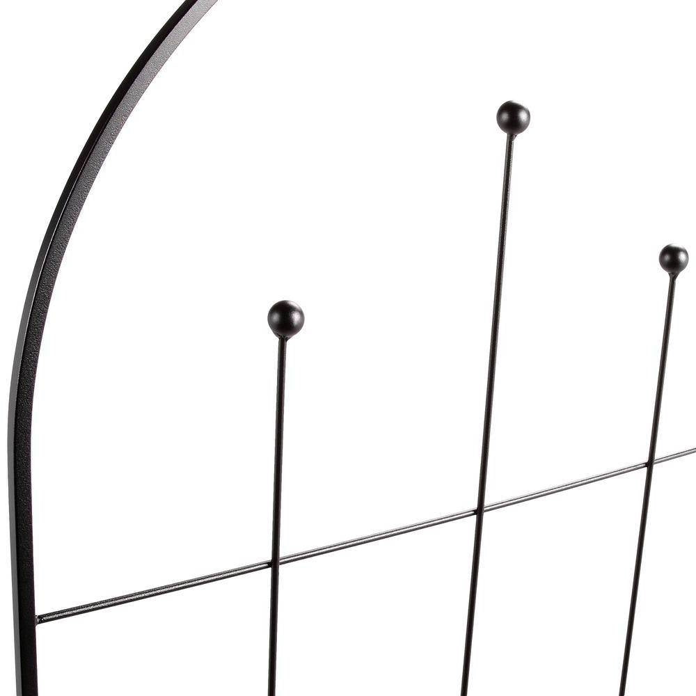 Close-up of a black metal headboard with curved design and vertical rods on a white background.  Henderson Garden Supply