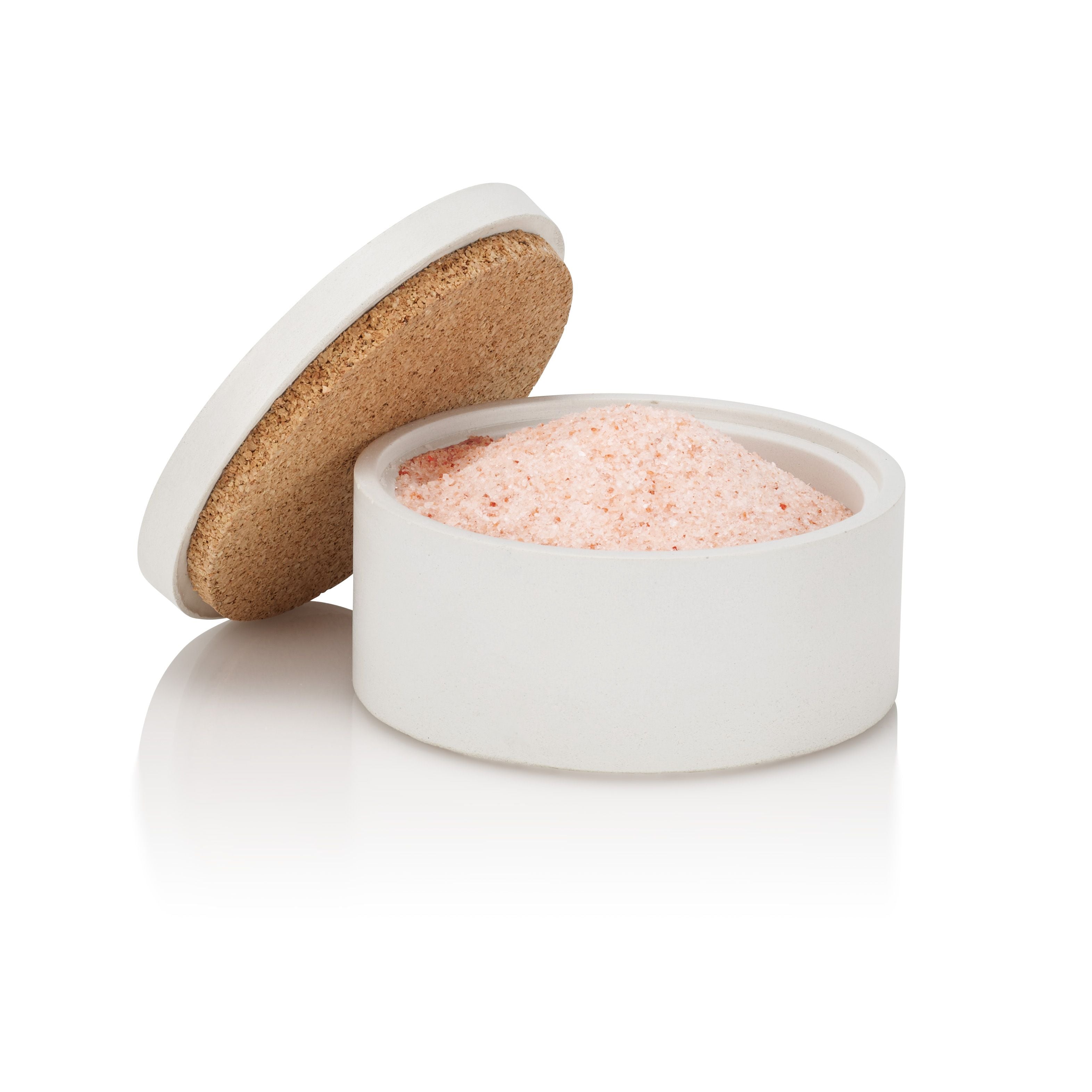White container with cork lid filled with pink salt on a white background.  Henderson Garden Supply