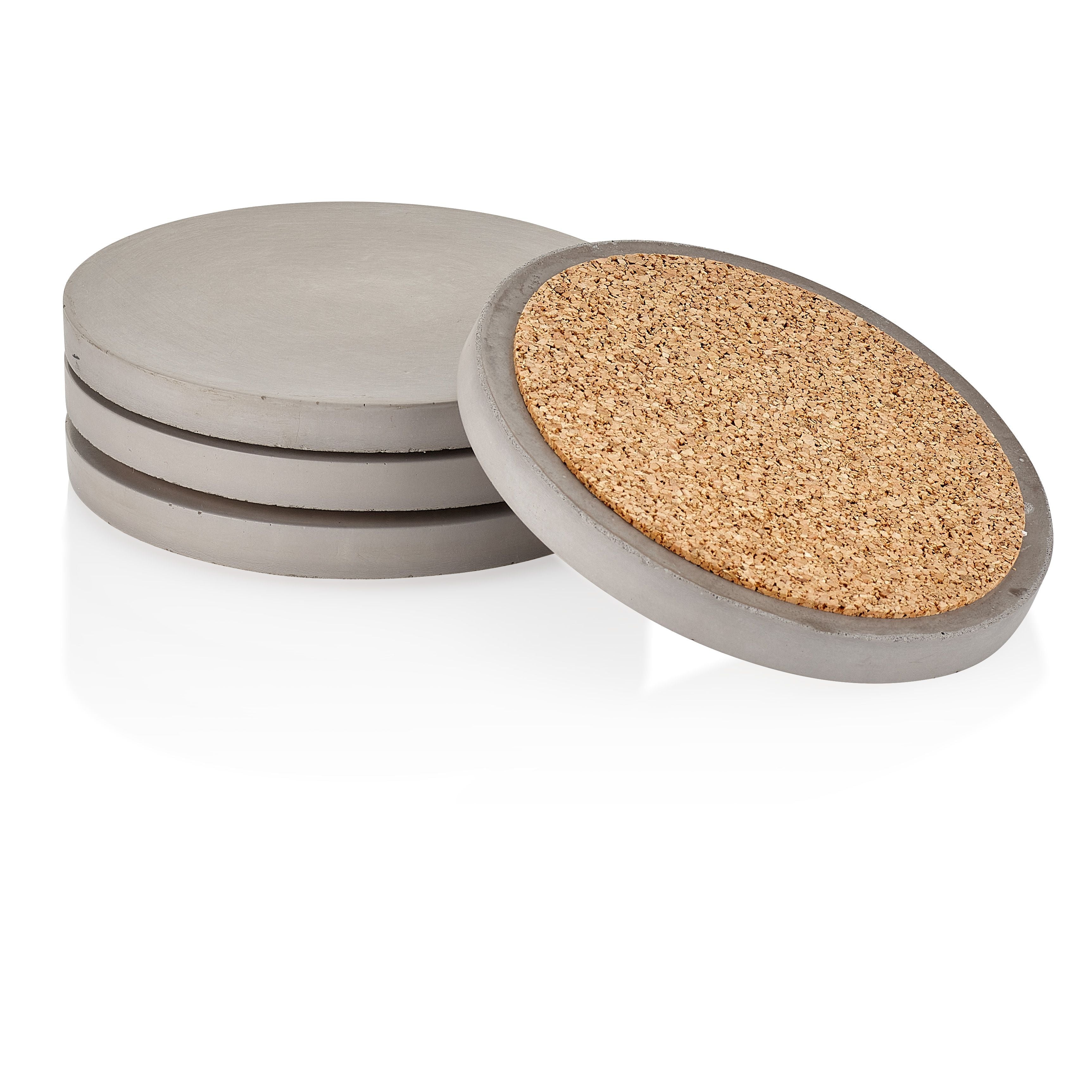 Set of round concrete coasters with cork backing on a white background.  Henderson Garden Supply