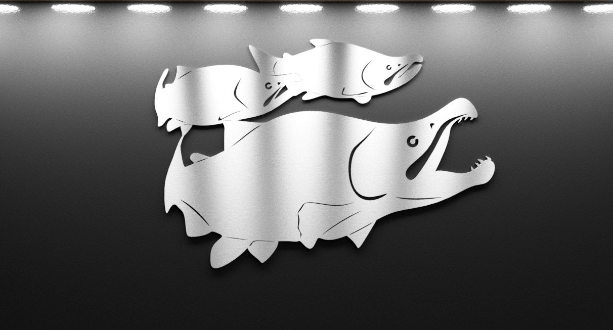 Metallic fish sculpture on a reflective surface with a gray background.  Henderson Garden Supply