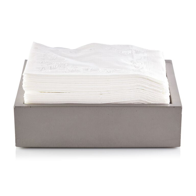 Stack of white napkins in a gray holder on a white background.  Henderson Garden Supply