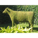 Cow Steel Topiary Frame filled with sphagnum moss pictured in a garden - Henderson Garden Supply